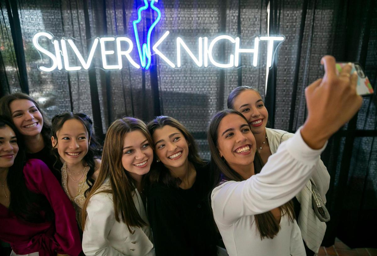 From left to right: Madison Fernandez, Cristyl Rodriguez, Brianna Page, Alexandra Santana, Kylie Quintana, Ashley Prats, and Rebeca Stacey, all from St. Brendan High School, take a selfie before the start of the 64th Annual Silver Knight Awards presented by the Miami Herald & el Nuevo Herald at the James L. Knight Center in Miami on Thursday, May 26, 2022. All of the students are Silver Knight nominees.