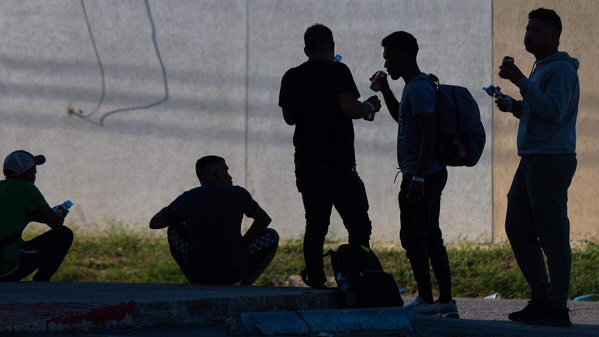On Wednesday, Sept. 21, 2022 a group of locals handed out food and beverages to migrants across the street from the Migrant Resource Center, where many are housed for period of three days in San Antonio, Texas.