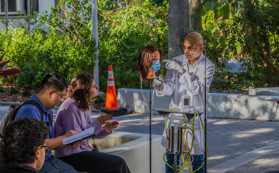 Naresh Kumar,a professor of environmental health at the University of Miami Miller School of Medicine talks to students during a pollen mask experiment at the University of Miami Medical Campus in Miami, Florida, on Tuesday March 18, 2025.
