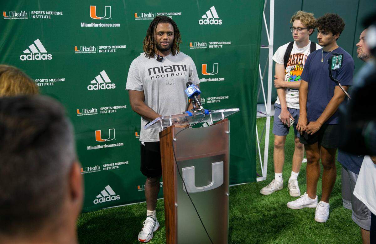 Miami Hurricanes linebacker Caleb Johnson (40) speaks at a press conference after running drills at the University of Miami’s Greentree Practice Fields on Monday, Aug. 15, 2022, in Coral Gables, Fla.