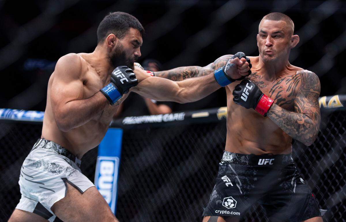 Dustin Poirier of the United States fights against Benoit Saint Denis of France during their lightweight title match during the UFC 299 event at the Kaseya Center on Saturday, March 9, 2024, in downtown Miami, Fla.