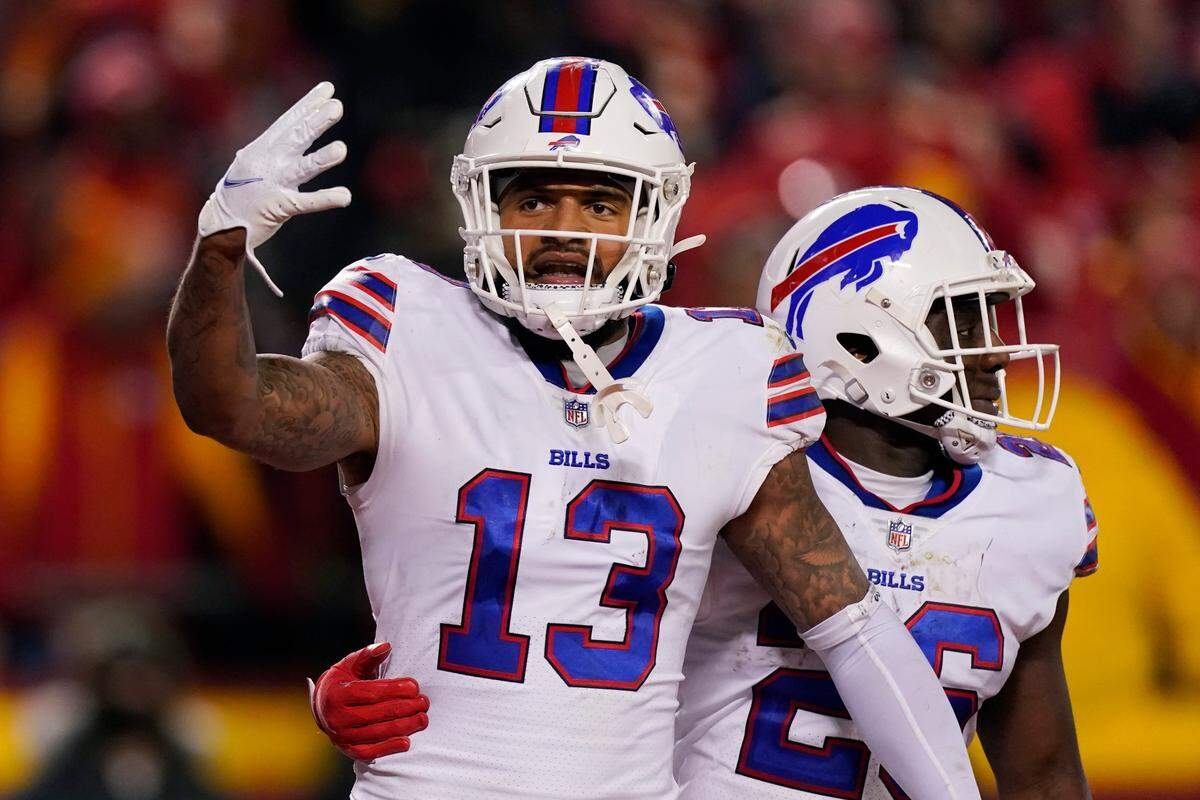 Buffalo Bills wide receiver Gabriel Davis (13) celebrates with teammate Devin Singletary (26) after catching a 19-yard touchdown pass during the second half of an NFL divisional round playoff football game against the Kansas City Chiefs, Sunday, Jan. 23, 2022, in Kansas City, Mo.
