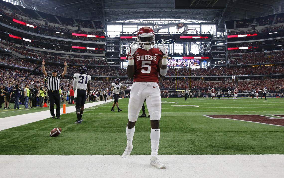 Oklahoma Sooners wide receiver Marquise Brown (5) scores in the third quarter as the University of Oklahoma beats Texas Christian University 41-17 in the Big 12 Conference Championship game at AT&T Stadium in Arlington, Texas, Saturday December 2, 2017.