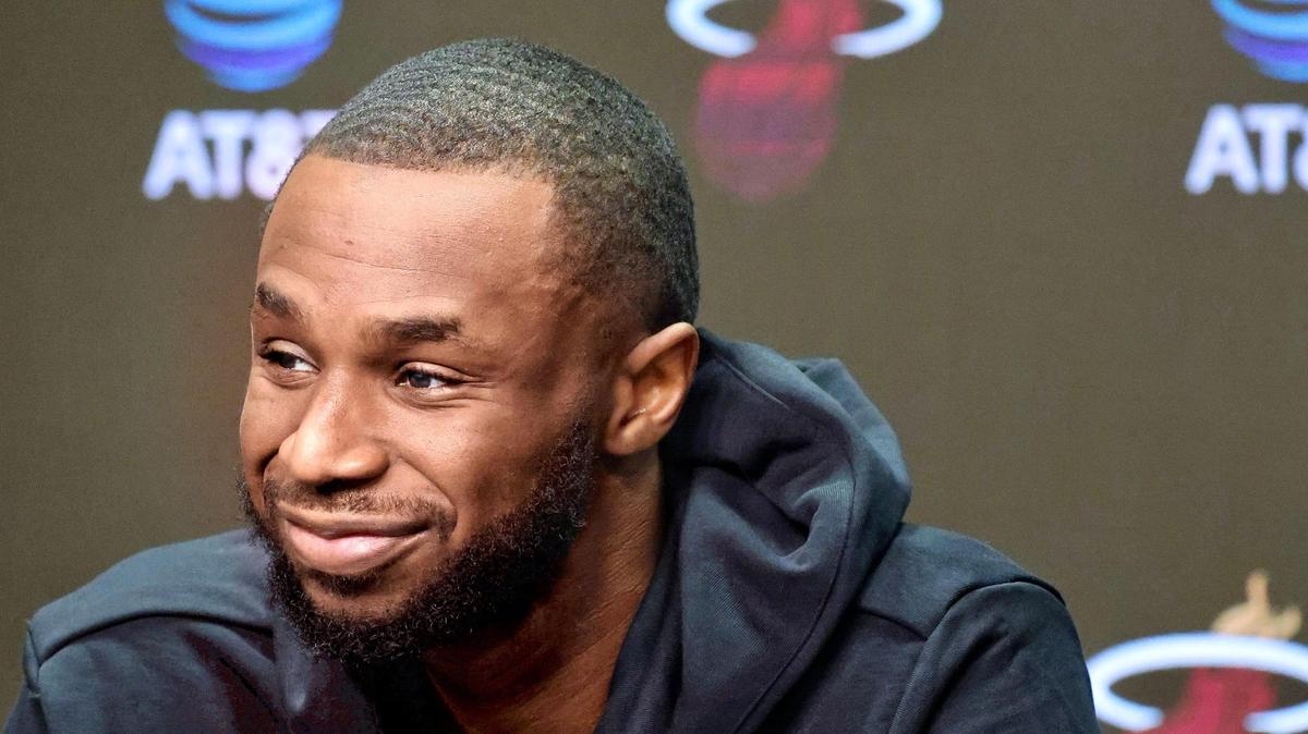 Miami Heat forward Andrew Wiggins (22) speaks at his introductory press conference alongside new teammates Kyle Anderson (20) and Davion Mitchell (45) at Kaseya Center in Miami, Florida, on Sunday, Feb. 9, 2025.