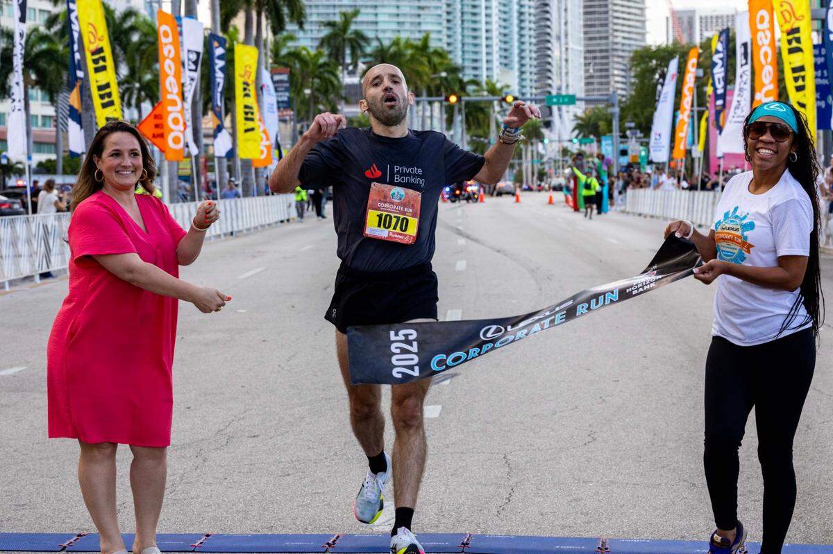 The overall first-place winner Tomas Vercellana Giraldez crosses the finish line during the 2025 Lexus Corporate Run on Thursday, April 24, 2025, in Miami, Fla. Over 18,00 runners participated in the 5K race’s 40th anniversary in Downtown Miami.