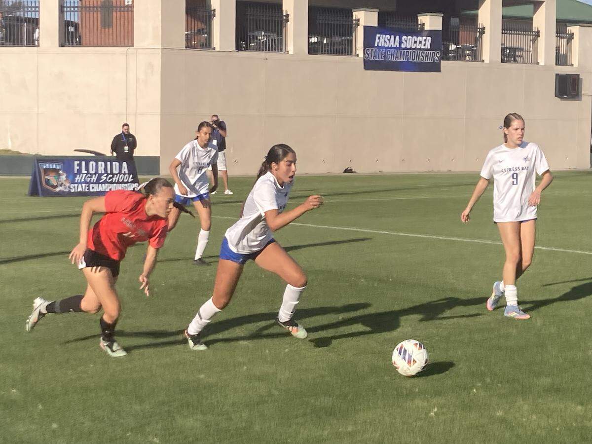 Cypress Bay’s Sabrina Bermudez (middle) dribbles downfield during the Class 7A state final vs. Lake Mary on Wednesday at Spec Martin Stadium in DeLand, Fla.