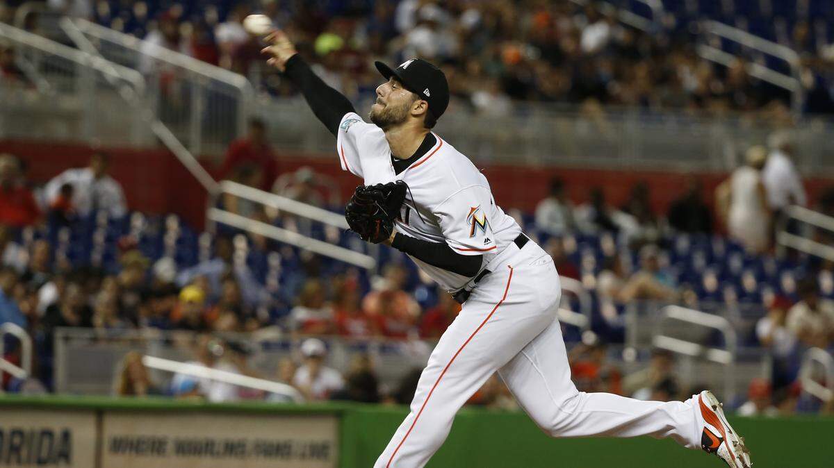 Miami Marlins’ Kyle Barraclough delivers a pitch during the ninth inning of a baseball game against the St. Louis Cardinals, Monday, Aug. 6, 2018, in Miami. The Marlins defeated the Cardinals 2-1. (AP Photo/Wilfredo Lee)