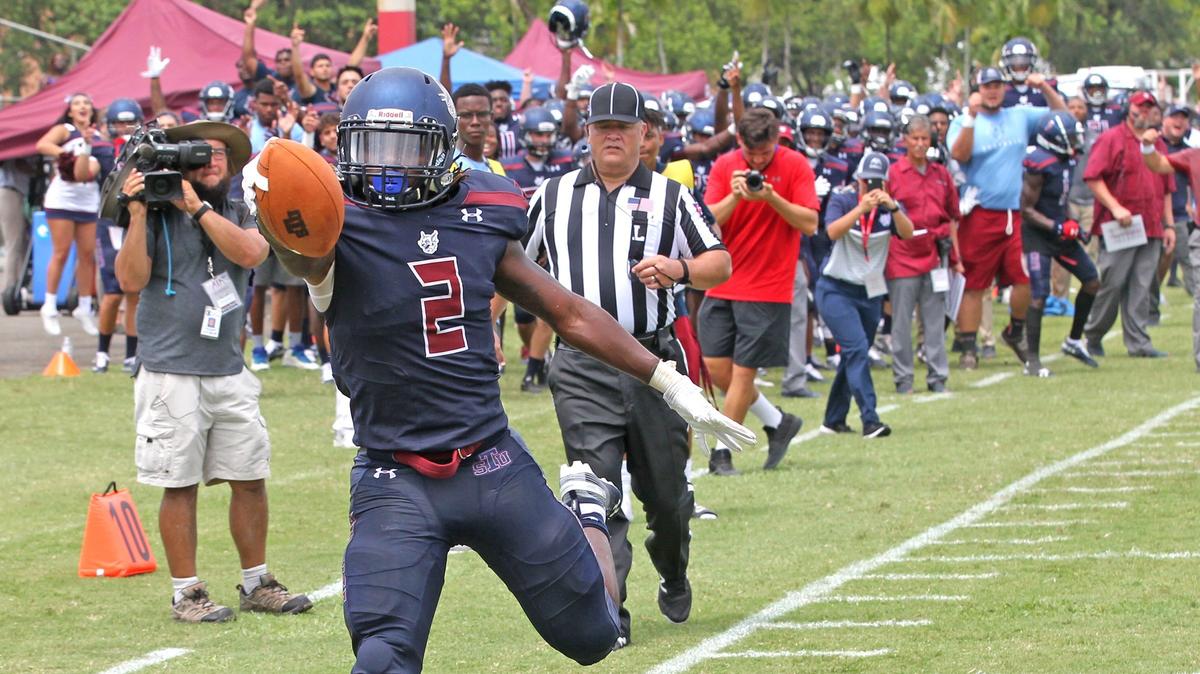 St. Thomas University running back Robert Armes scores the school's first touchdown in the third quarter against the Thomas Moore Saints at Pace High School in Miami Gardens on Saturday, Sept. 7, 2019.