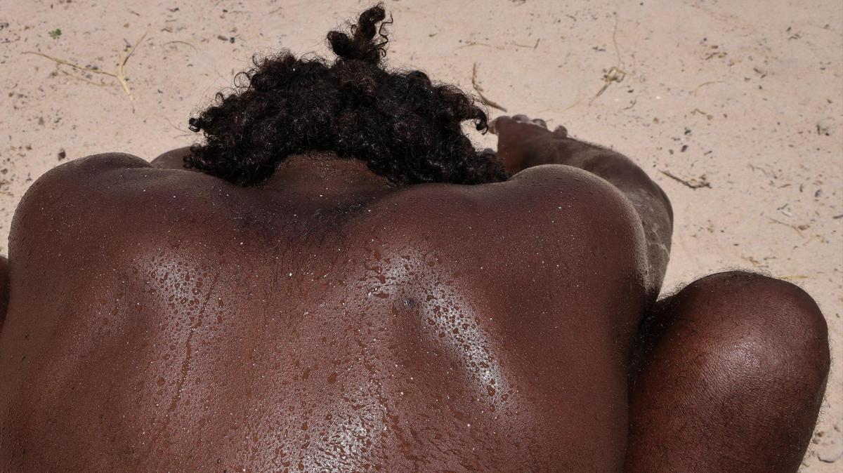 Beads of sweat drips down the back of David Hicks, 46, a Miami Beach resident and DJ, after working out at the My Equilibra, a Miami Beach wellness park in August 2023. Especially if exercising outside, remember to drink plenty of water.