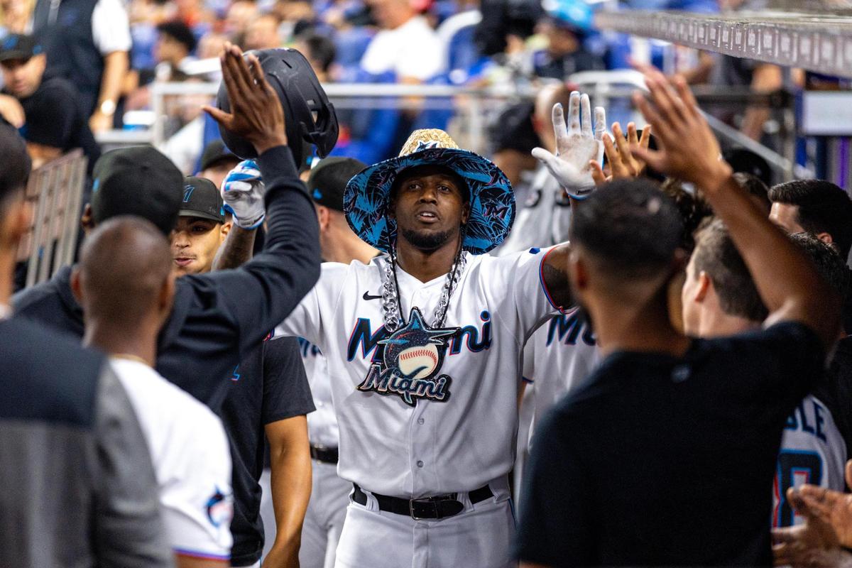 Miami Marlins base runner Jorge Soler (12) reacts with teammates after hitting a two run homerun during the third inning of an MLB game against the Houston Astros at loanDepot park in the Little Havana neighborhood of Miami, Florida, on Tuesday, August 15, 2023.