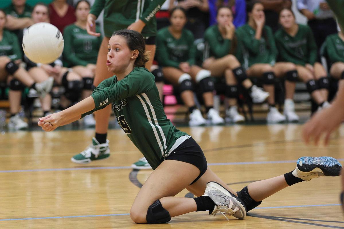 Westminster Christian Warriors defensive specialist Cassie Thomas (19) dives for a dig against the Palmer Trinity Falcons during the third set of a volleyball Region 4-3A quarterfinal playoff match at Westminster Christian School in Palmetto Bay, Florida, Tuesday, October 24, 2023.