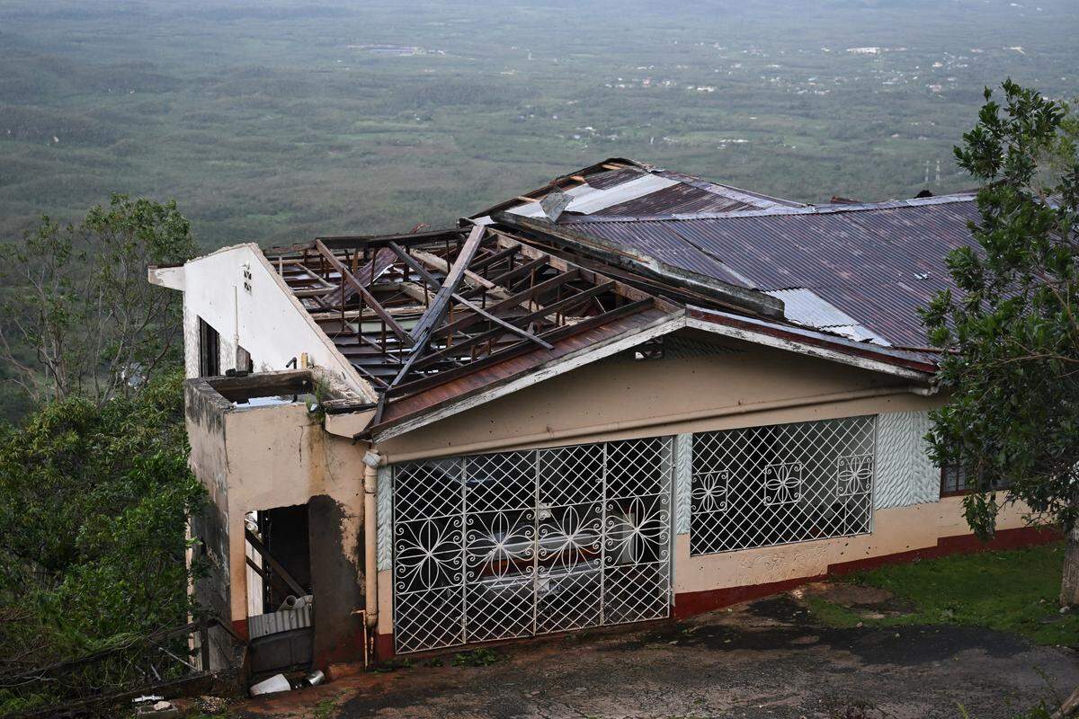 Hurricane Melissa ripped up trees and knocked out power after making landfall in Jamaica on October 29, 2025 as one of the most powerful hurricanes on record, inundating the island nation with rains that threaten flash floods and landslides. 