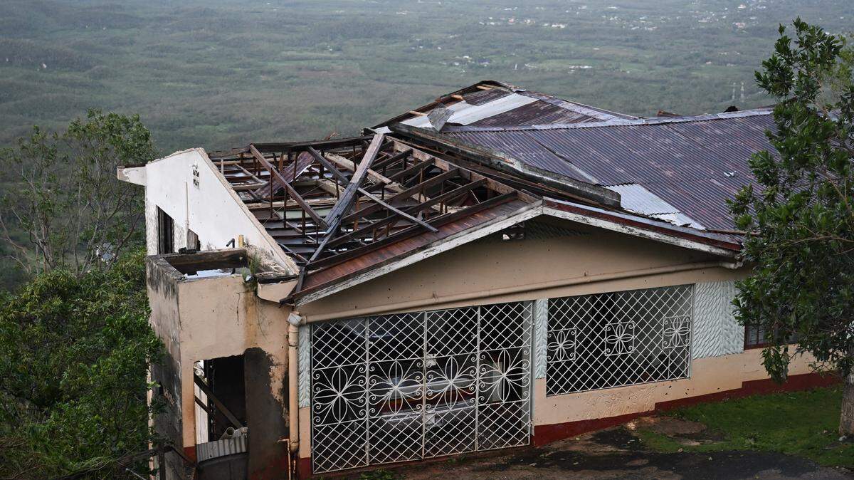 Hurricane Melissa ripped up trees and knocked out power after making landfall in Jamaica on October 29, 2025 as one of the most powerful hurricanes on record, inundating the island nation with rains that threaten flash floods and landslides.