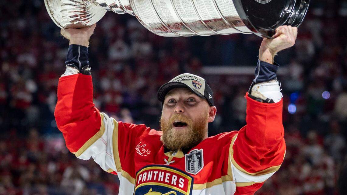 Florida Panthers center Sam Bennett (9) lifts the Stanley Cup after the Panthers defeated the Edmonton Oilers in Game 6