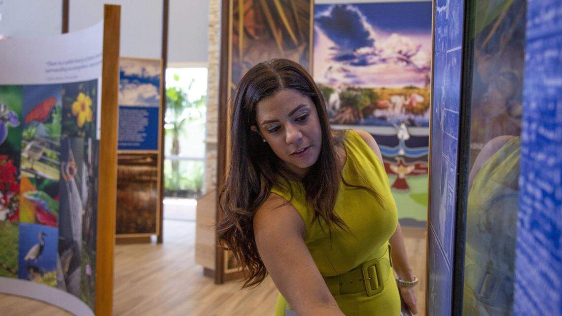 Parks & Recreation Director Barbara Hernandez uses a touch screen installed at the Nature Center, one of the amenities inside Doral Glades Park, a new park in Doral, Florida, on Wednesday, July 31, 2019.