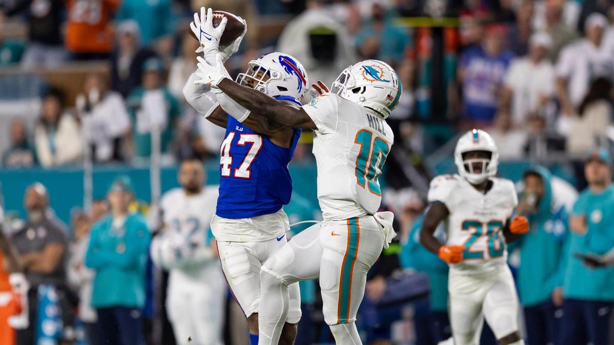 Buffalo Bills cornerback Christian Benford (47) intercepts a pass to Miami Dolphins wide receiver Tyreek Hill (10) in the first quarter of an NFL game at Hard Rock Stadium on Sunday, Jan. 7, 2023, in Miami Gardens Fla.