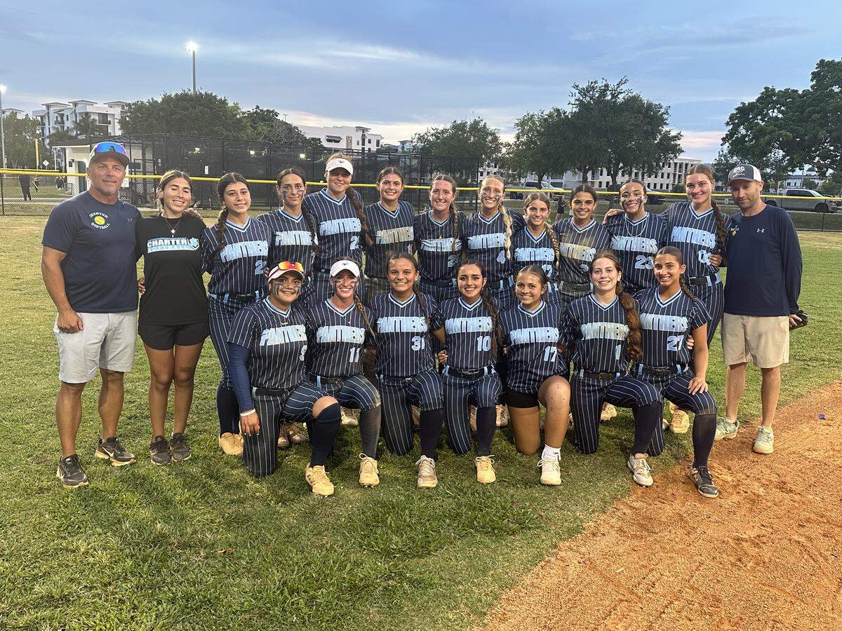 Coral Springs Charter’s softball team poses for a team photo after beating Somerset Silver Palms on Tuesday in a Region 4-3A semifinal at Palmetto Bay Park.