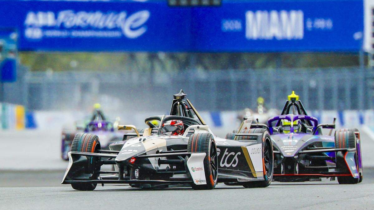 Mitch Evans of Team Jaguar TCS Racing and Nico Muller of Team Porsche Formula E Team race in the final laps for first and second place during the all electric Formula Miami E-Prix at the Miami International Autodrome at Hard Rock Stadium in Miami Gardens, Florida on Saturday, January 31, 2026.