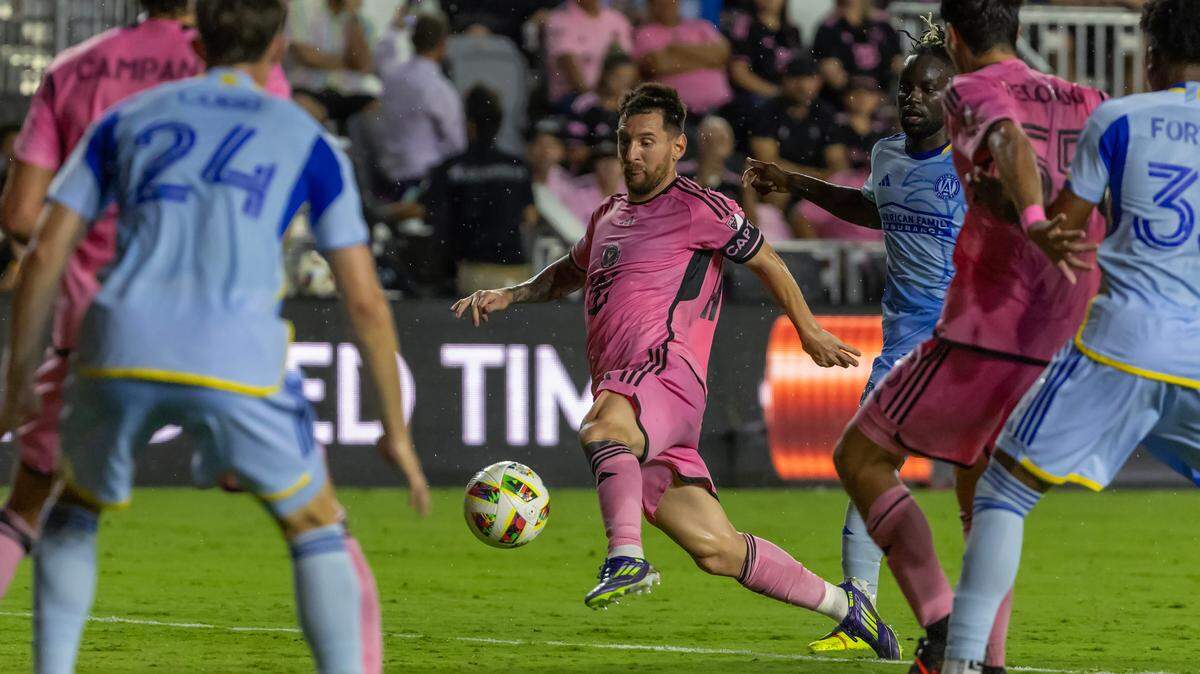 Inter Miami forward Lionel Messi (10) tries to control the ball as teammate Tristan Muyumba (8) defends in second half of their MLS match at Chase Stadium on Wednesday, May 29, 2024, in Fort Lauderdale, Fla.