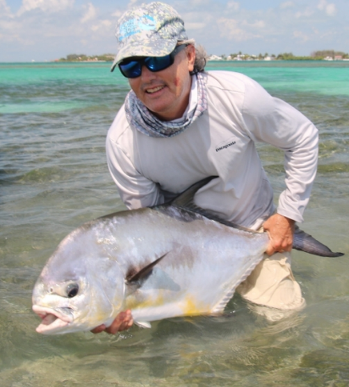 Marine biologist Aaron Adams, conservation director at the Bonefish & Tarpon Trust, pictured with permit. Courtesy Bonefish Tarpon Trust