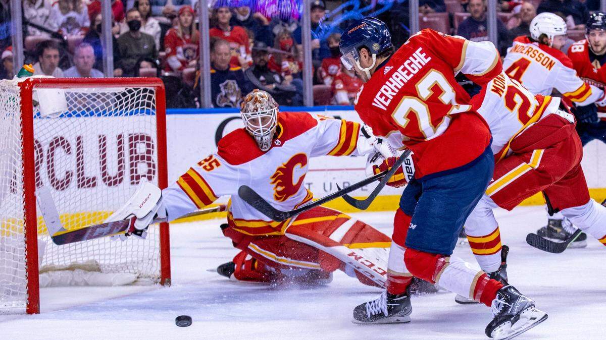 Florida Panthers center Carter Verhaeghe (23) shoots on Calgary Flames goalie Jacob Markstrom (25) during the second period of an NHL game at FLA Live Arena in Sunrise, Florida, on Tuesday, January 4, 2022.