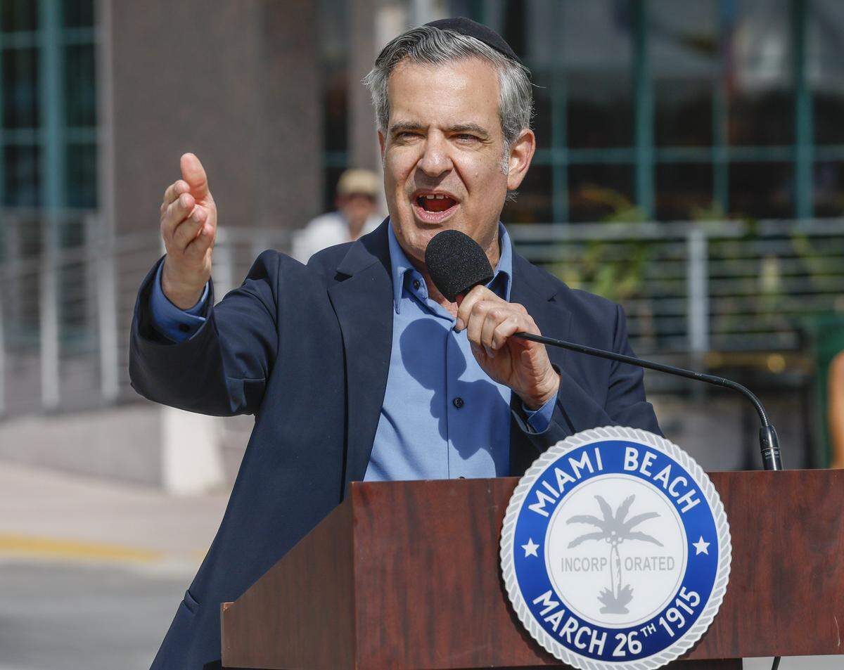 Miami Beach Mayor Steven Meiner speaks as city officials and community members gather in Lummus Park for the unveiling of a rebuilt LGBTQ+ crosswalk made of 3,606 colorful pavers on Friday, April 10, 2026. The installation was created less than six months after the Florida Department of Transportation removed the original crosswalk at 12th Street and Ocean Drive in Miami Beach, Florida.