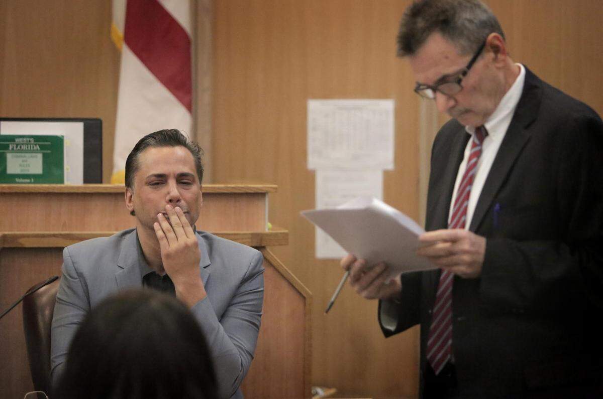 Kevin Tomlinson tries to remain composed during question by the attorney for the state, Al Guttman, during a violation of probation hearing. Tomlinson, who was originally convicted of extorting his high-profile rivals, The Jills, was sent to jail for one year for violating his probation agreement.
