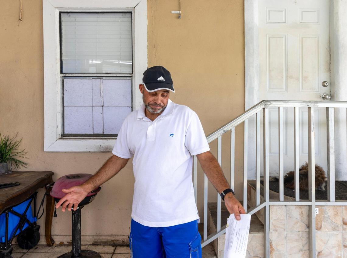 Hamilton Dos Santos stands outside his mobile home, which he purchased in cash just a few months prior to receiving an order to vacate, on Thursday, Nov. 14, 2024, in Sweetwater, Florida.