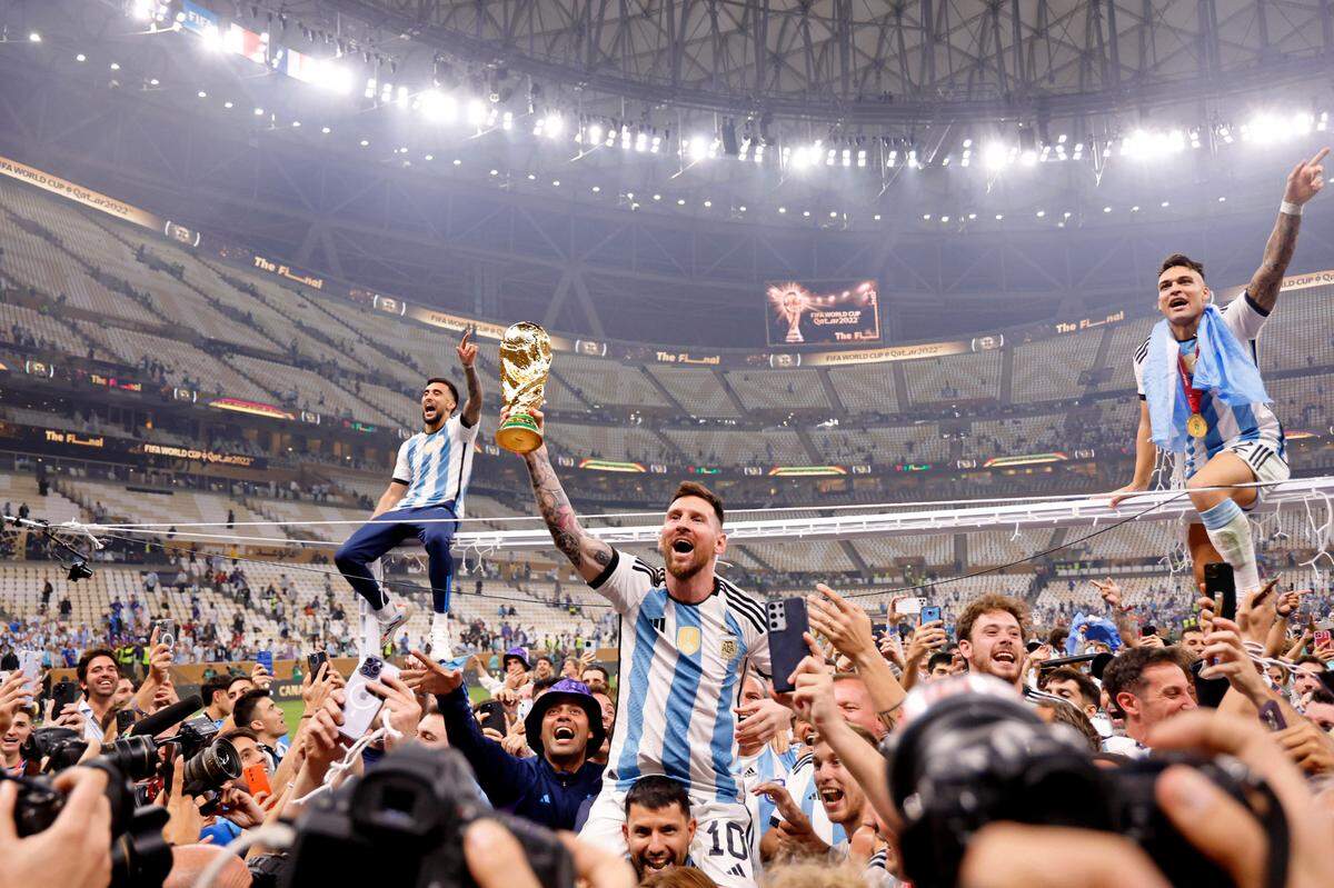 Dec 18, 2022; Lusail, Qatar; Argentina forward Lionel Messi (10) celebrates with fans after winning the 2022 World Cup final against France at Lusail Stadium.