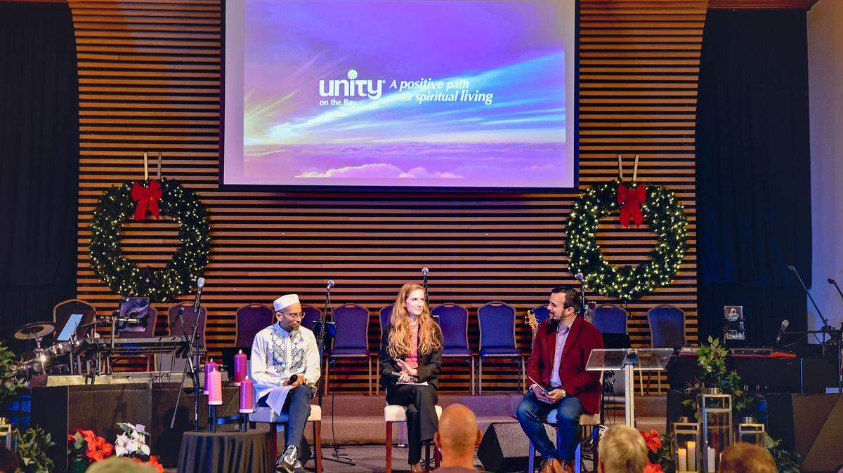 Faith leaders Dr. Iqbal Akhtar (left), Rabbi Rachel Greengrass and Rev. Juan del Hierro lead an interfaith service before the “Breaking Bread/Breaking Bias” potluck at Unity on the Bay.