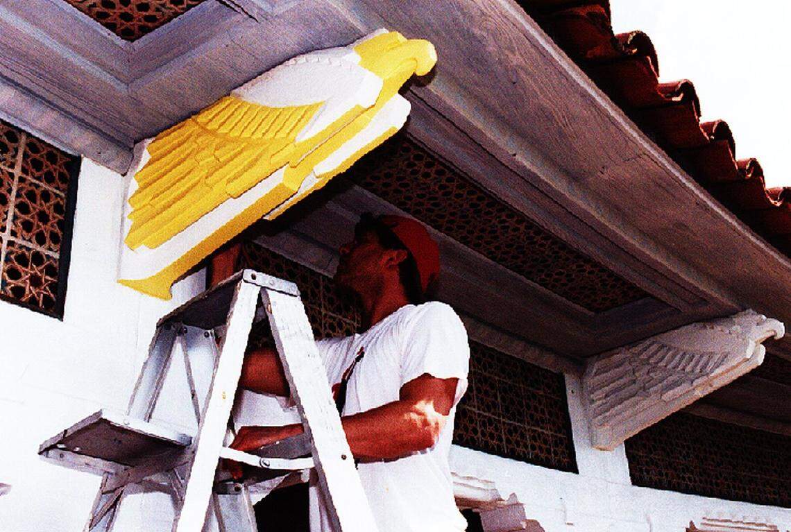 A worker restoring a piece at Mar-a-Lago in 1999.