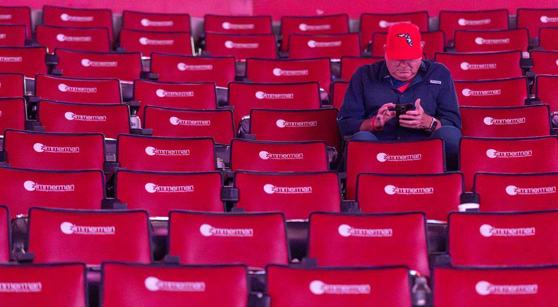 A Florida Panthers fan looks at his phone during a watch party after the Edmonton Oilers scored in Game 1 of the NHL Stanley Cup Final at the Amerant Bank Arena on Wednesday, June 4, 2025, in Sunrise, Fla.