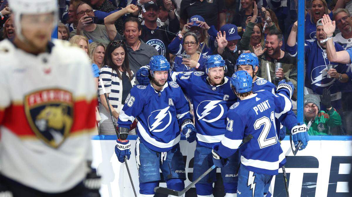 Apr 27, 2024; Tampa, Florida, USA Tampa Bay Lightning center Steven Stamkos (91) is congratulated by right wing Nikita Kucherov (86), defenseman Matt Dumba (24) and center Brayden Point (21) after he scored a goal against the Florida Panthers during the third period in game four of the first round of the 2024 Stanley Cup Playoffs at Amalie Arena.