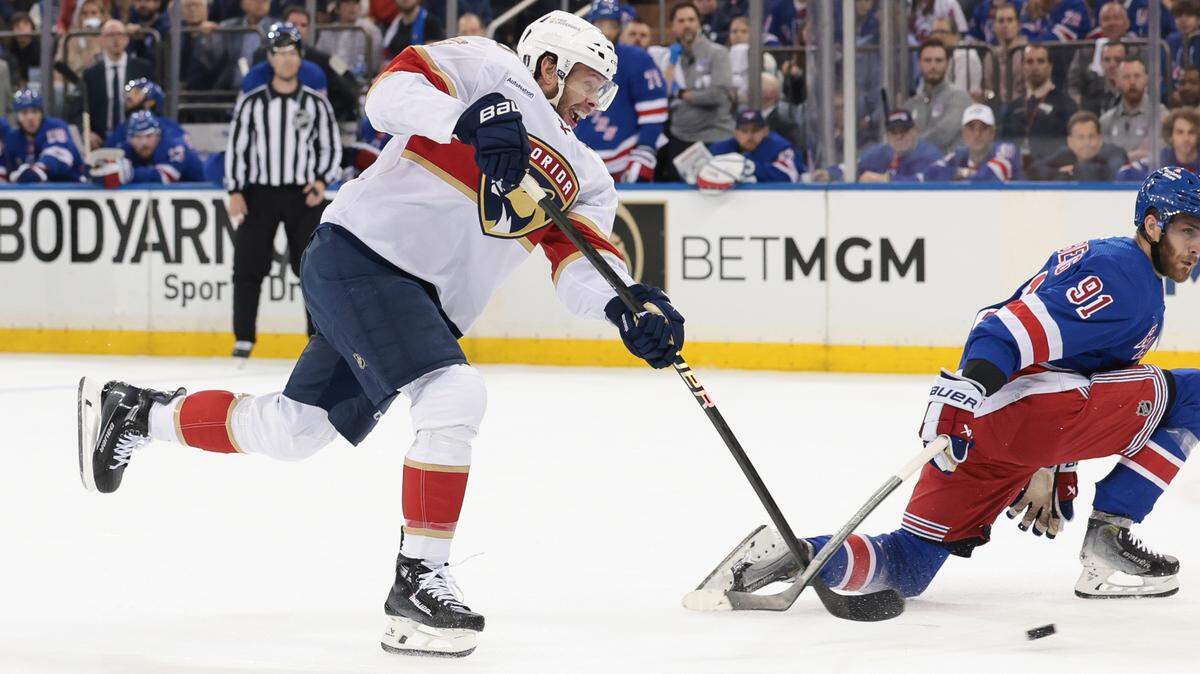 May 24, 2024; New York, New York, USA; Florida Panthers center Carter Verhaeghe (23) scores a goal as New York Rangers center Alex Wennberg (91) defends during the first period in game two of the Eastern Conference Final of the 2024 Stanley Cup Playoffs at Madison Square Garden. Mandatory Credit: Vincent Carchietta-USA TODAY Sports