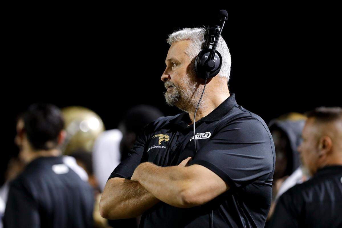 Western Wildcats head coach Adam Rackevich looks on from the sideline against Columbus during a second-round high school football playoff game at Western High School in Davie, Florida on Friday, November 19, 2021.