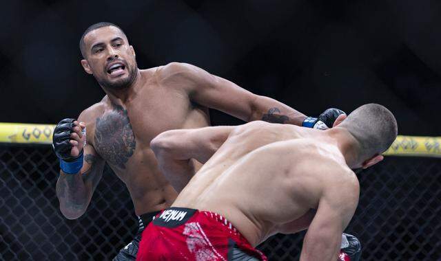 Jiří Procházka of Czechia and Carlos Ulberg of New Zealand fight in their light heavyweight title bout at UFC 327 at the Kaseya Center on Saturday, April 11, 2026, in downtown Miami, Fla.