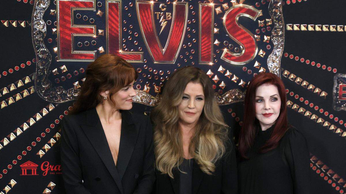 Riley Keough, from left, Lisa Marie Presley and Priscilla Presley greet the press during a red carpet event before the screening for the new biopic movie 'Elvis' at Graceland in Memphis, Tenn. on Saturday, June 11, 2022.