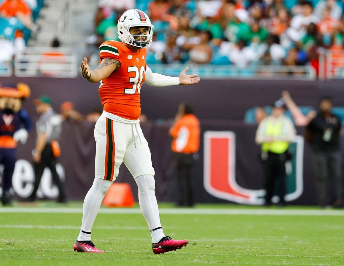 Miami Hurricanes place kicker Andres Borregales (30) reacts after scoring a three-pointer in the second half against the Virginia Cavaliers at Hard Rock Stadium in Miami Gardens on Saturday, October 28, 2023.