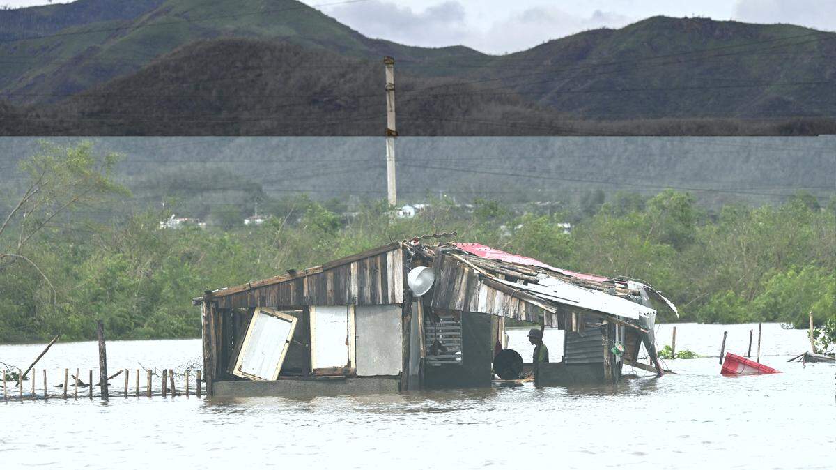 A farmer remains inside his flooded house after Hurricane Melissa battered the town of San Miguel de Parada in Santiago de Cuba province on Oct. 29, 2025. A powerful Hurricane Melissa made landfall in eastern Cuba, causing damage and flooding to homes and streets in eastern Cuba.