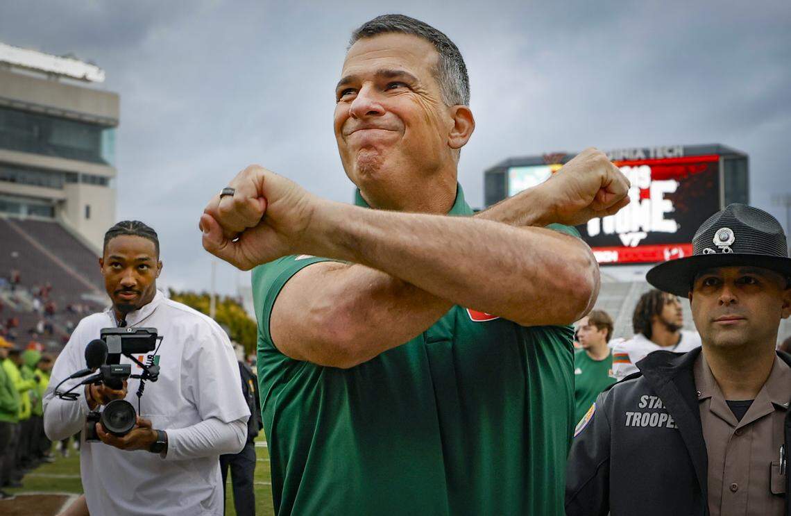 Miami Hurricanes head coach Mario Cristobal celebrates as he comes off the field after the Canes defeat the against the Virginia Tech Hokies at Lane Stadium in Blacksburg, Virginia, on Saturday, November 22, 2025.