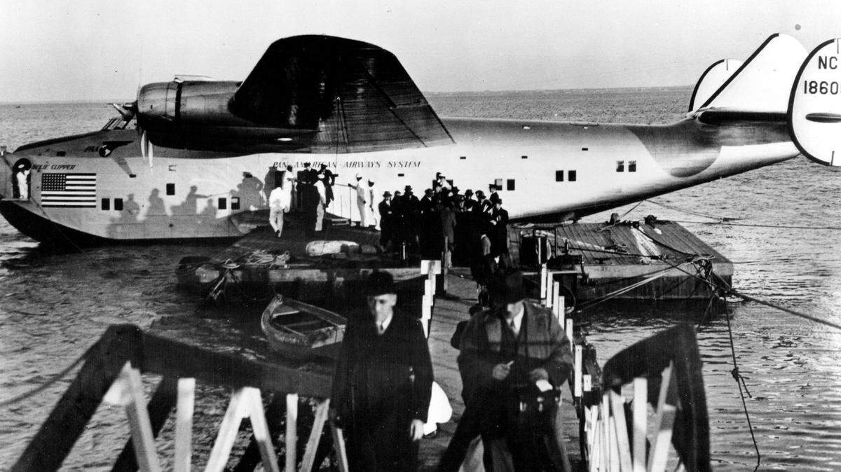 Passengers disembark from Pan Am’s clipper after its historic first transatlantic flight, from Port Washington near New York City to Lisbon on June 28-29, 1939. The luxurious Boeing 314 flying boat completed the trip in 24 hours, 15 minutes with a refueling stop in the Azores. It continued from Lisbon to Marseilles.