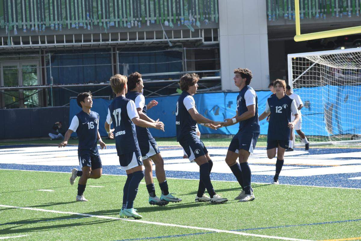 Gulliver boys’ soccer players celebrate after a goal on Tuesday during their Region 4-4A quarterfinal win over Cardinal Gibbons at Gulliver Prep.