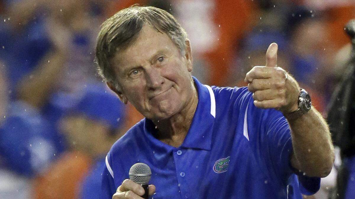 In this Saturday, Sept. 3, 2016, file photo, former Florida player and head coach Steve Spurrier makes remarks after he was honored during an NCAA college football game against Massachusetts in Gainesville, Florida.