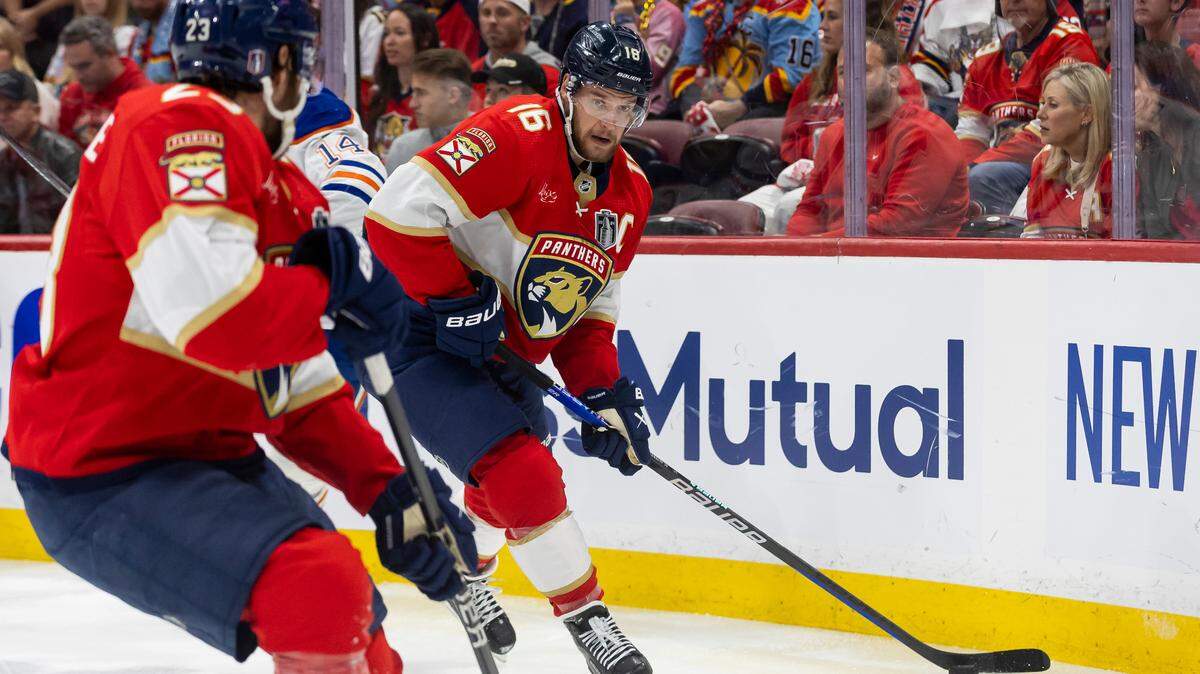 Florida Panthers center Aleksander Barkov (16) skates with the puck as Edmonton Oilers defenseman Mattias Ekholm (14) defends in the first period of Game 2 of the NHL Stanley Cup Finals at the Amerant Bank Arena on Monday, June 10, 2024, in Sunrise, Fla.