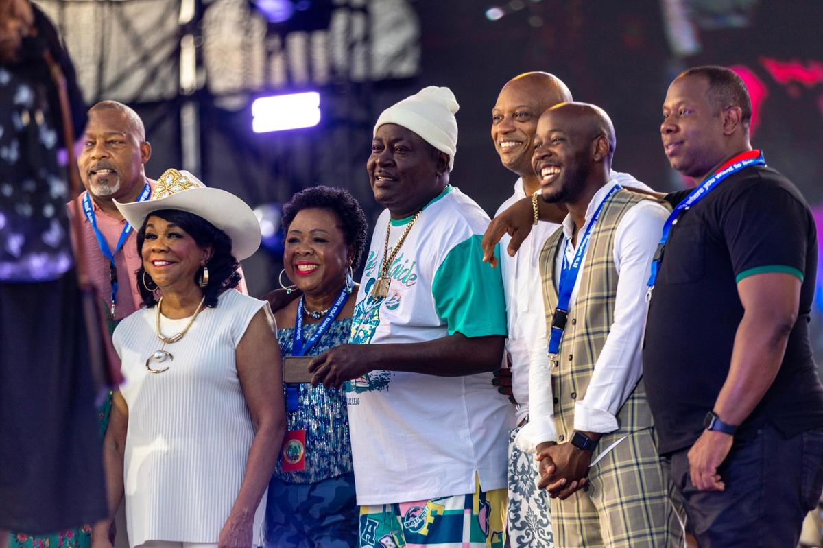 Musical artist Trick Daddy, center, is honored with the key to the city alongside Mayor Rodney Harris, far left, Congresswoman Frederica Wilson, second from left, Commoner Chair Oliver G. Gilbert, III, third from right, Jazz in the Gardens at Hard Rock Stadium Arena in Miami Gardens, Florida, on Saturday, March 9, 2024.