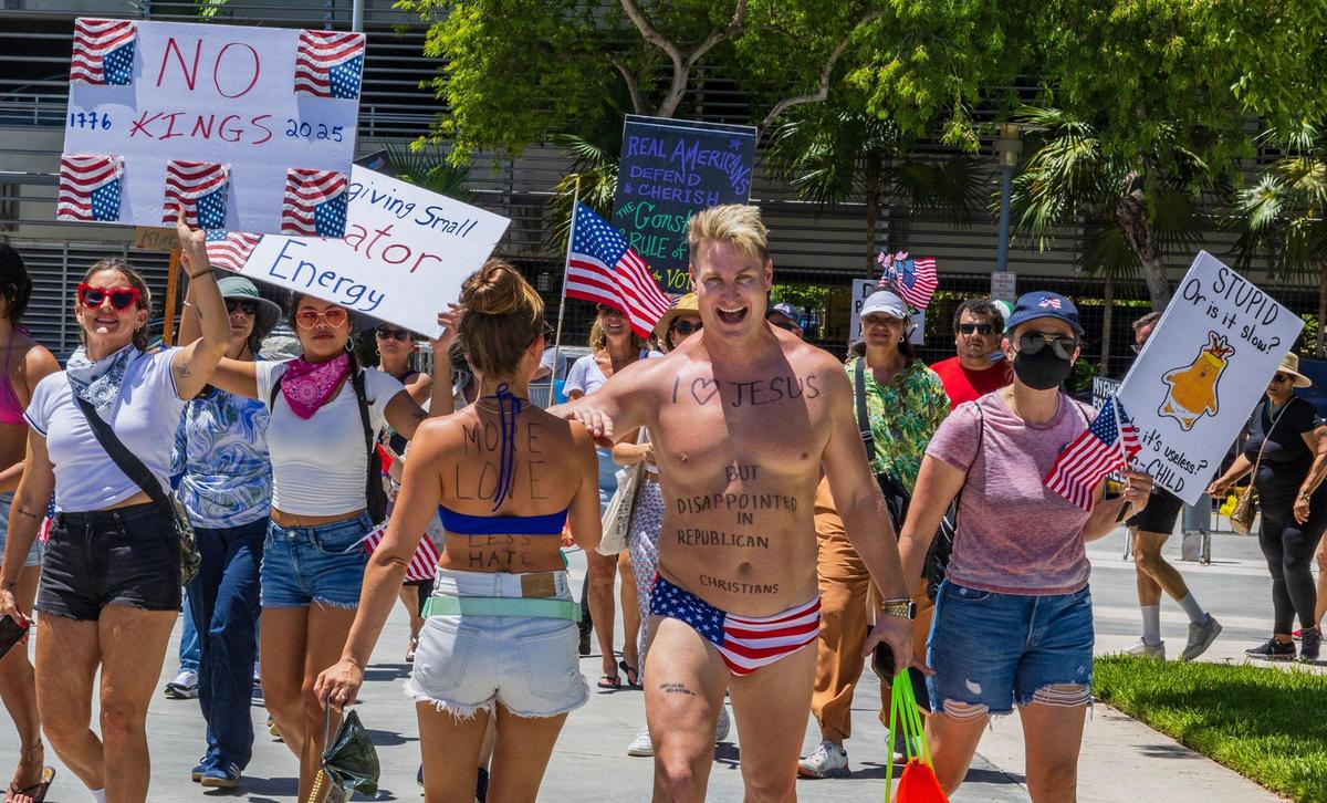 Protesters including Emily Arko and Mathew Wilson, expressed their opinions as they marched around the Pride Park in Miami Beach during the ‘No Kings’ anti-Trump protests taking place all across South Florida, on Saturday June 14, 2025.