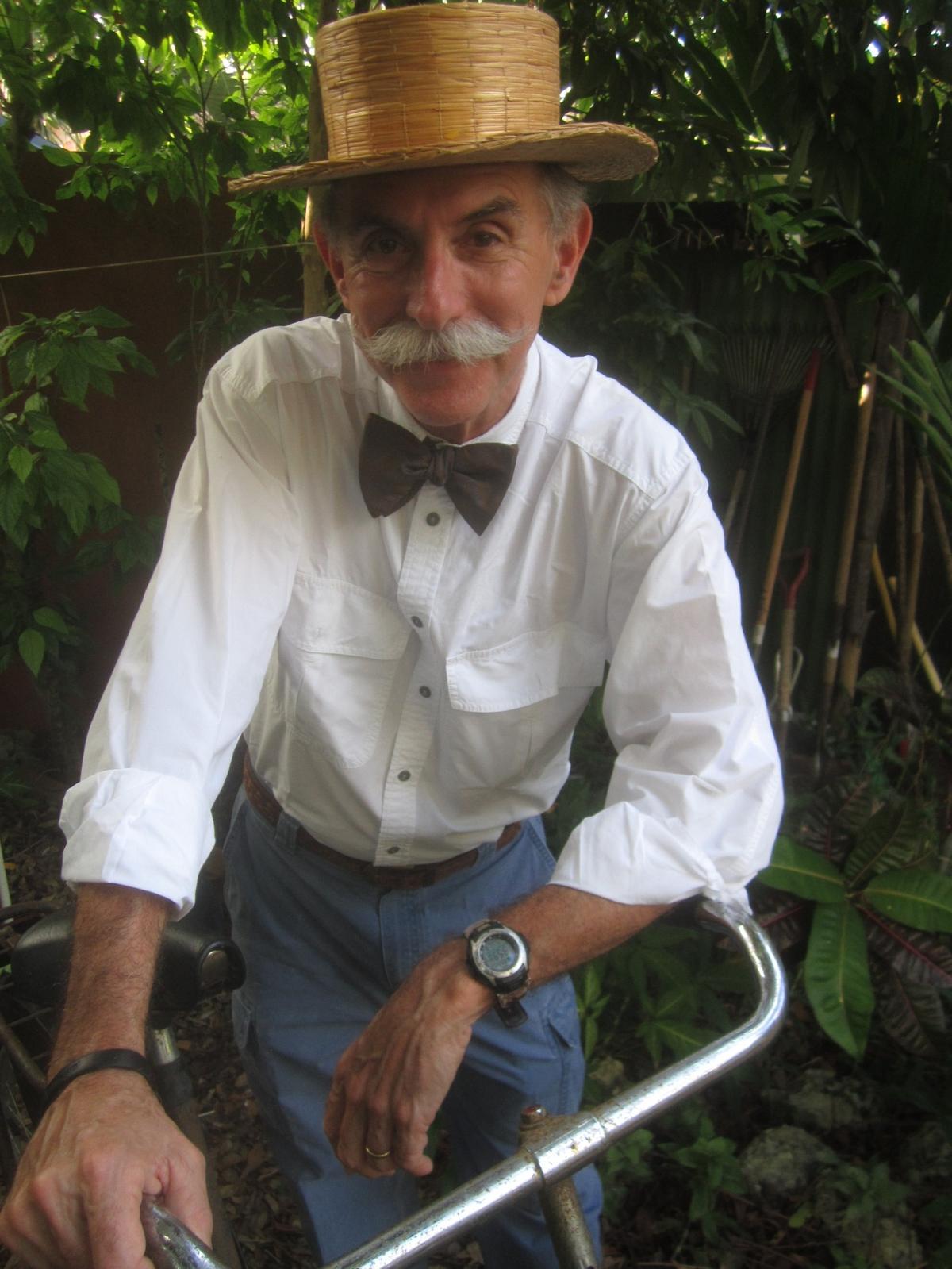 A photo of Murry Sill on his beloved bicycle in Coconut Grove. The photo was taken by his friend Glenn Terry. “Murry helped we with one of my many, weird projects, ‘King Mango’s Magical Mystery History Tour of Coconut Grove’ in 2015. With that ‘stache o’ his, I figured he could go back 110 years with ease. So, I had him riding my antique bike and complaining about the horseless carriages that were ruining the Grove,” Terry said.