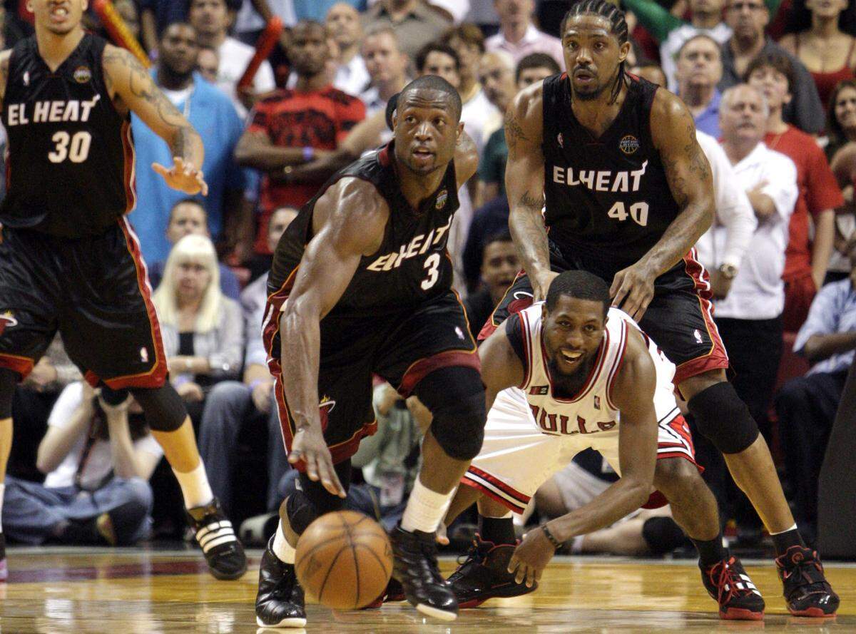 Heat’s Dwyane Wade steals the ball in the final seconds of the second overtime and eyes the basket and then hits a three-pointer to beat the Bulls on March 9, 2009.