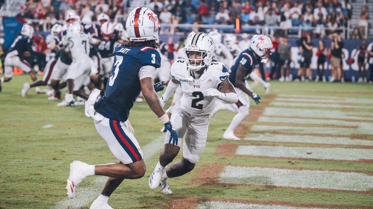 Florida International University Panthers defensive back Brian Blades II (2) defends Florida Atlantic Owls wide receiver Jayshon Platt (3)