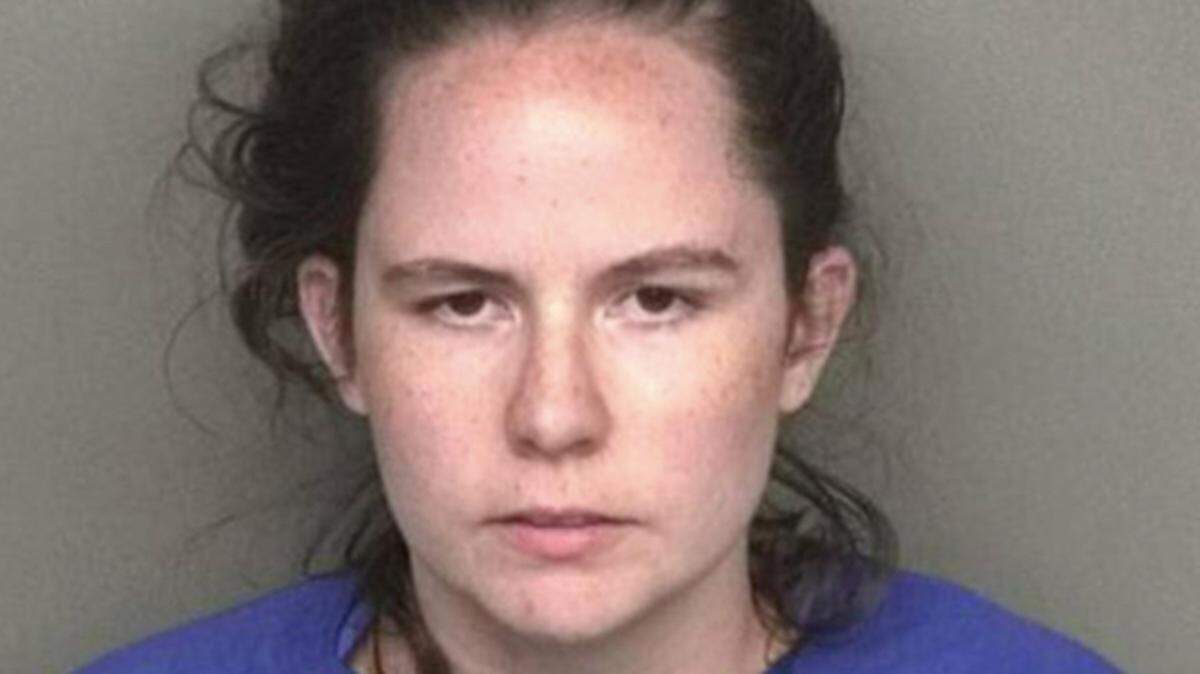 Kiley White, 26, is charged with theft by deception and harassment.